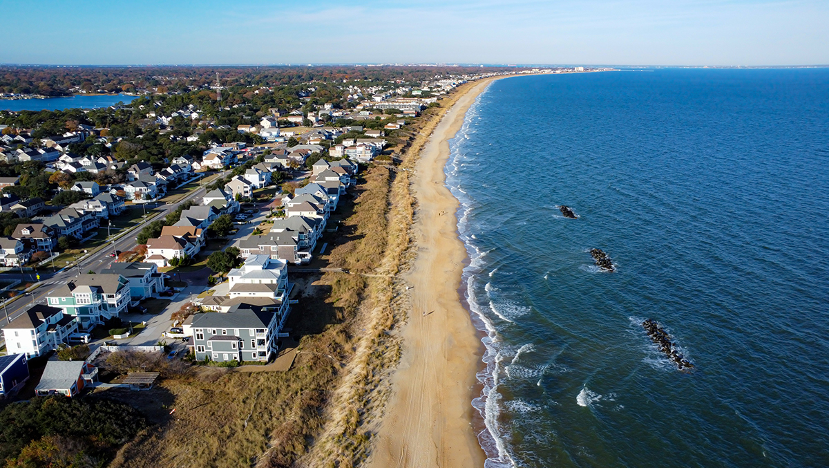 Aerial view of luxury beachfront homes at Sandbridge Beach, Virginia, perfect for busy professionals seeking expert vacation rental management and boutique co-hosting services focused on maximizing revenue and delivering five-star guest experiences.